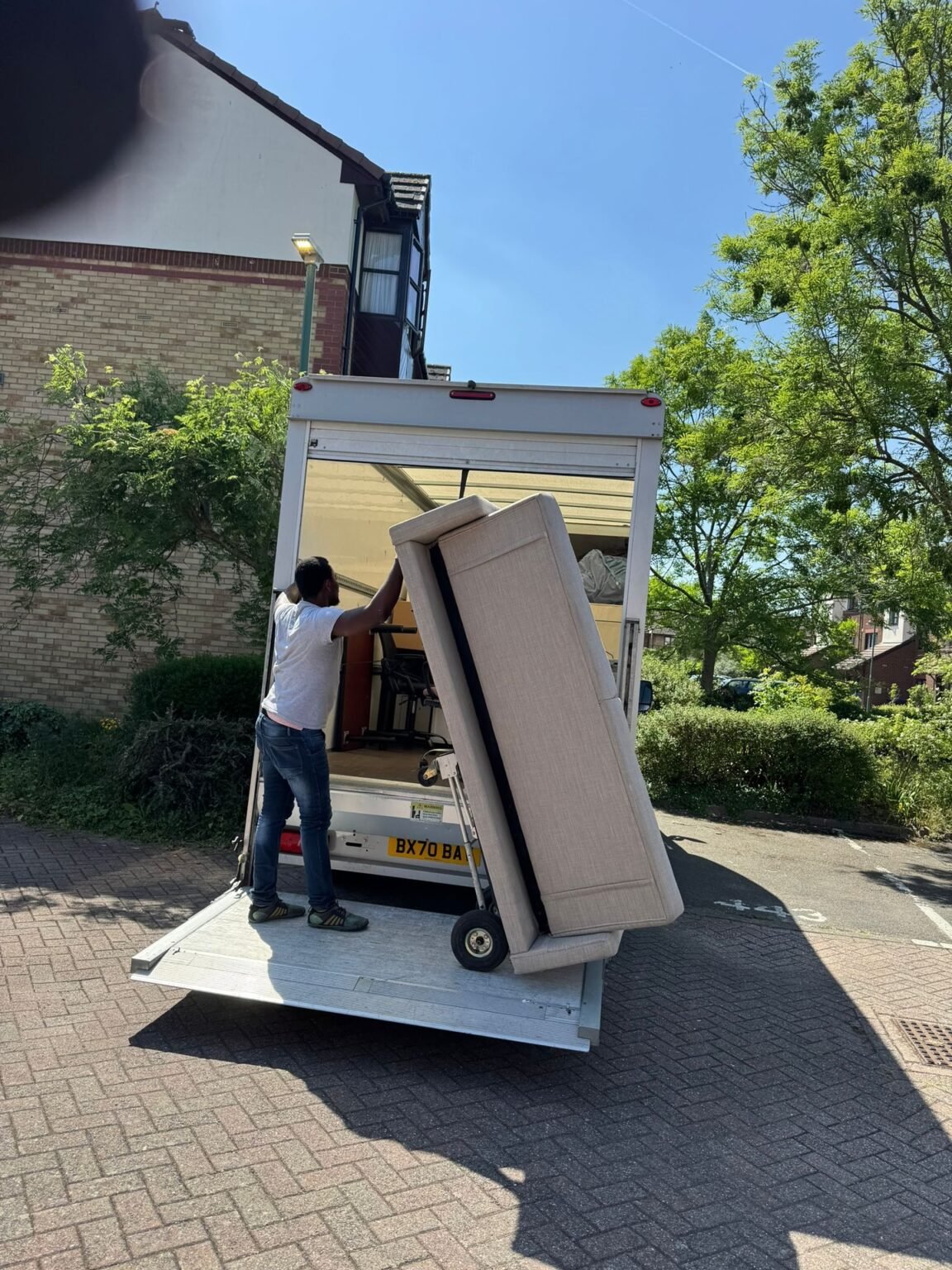 House removals South London team loading a sofa into a moving van