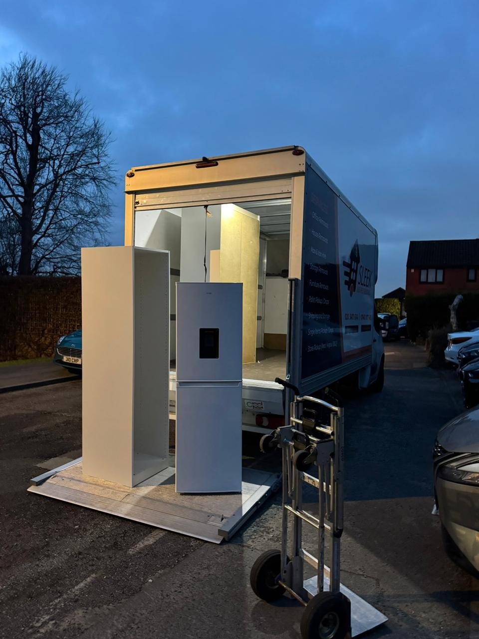 House removals London van with home furniture loaded for moving