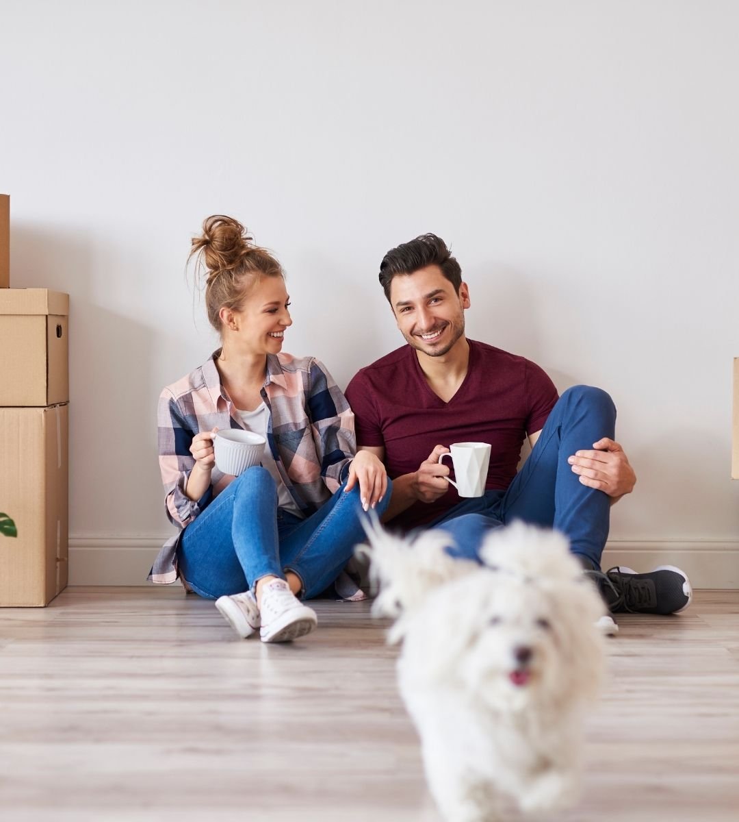 A Happy Client Smiling with Tea in Their Home After the Move.