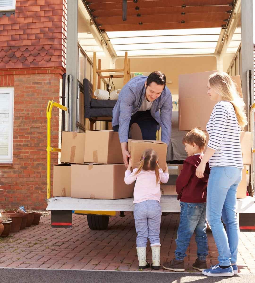 Removal worker unloading boxes