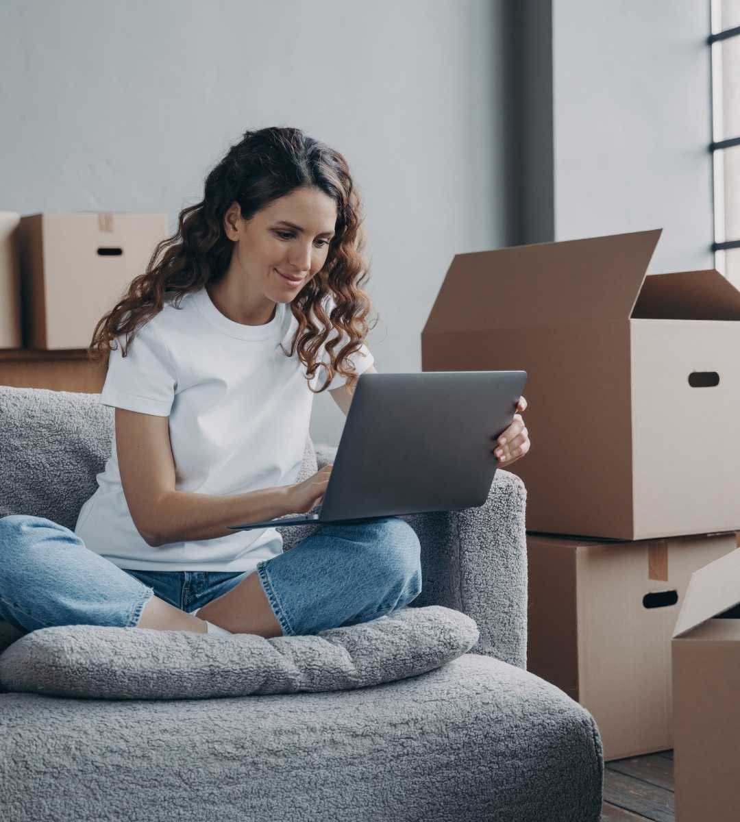 sofa with moving boxes in East London flat