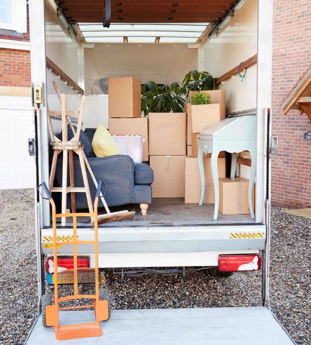 Household furniture and moving boxes packed for relocation